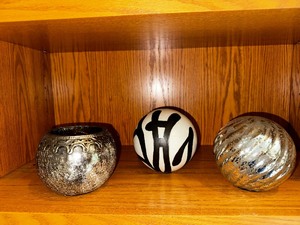 lot 12 image: Three Decorative Ball Ceramic Black And White, Silver Glass And Candle Holder
