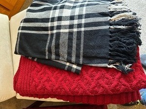 lot 15 image: Two Throw Blankets, One Red Knit, Cable Knit, And One Black-And-White Plaid