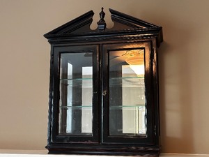 lot 22 image: Antique Black Painted Wood And Glass Display Cabinet Measuring 20 x 7 x 27