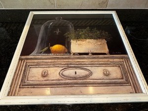 lot 41 image: Lemon Cloche By Arnie Fisk Framed Print Measuring 19 12 X 19 12 In Cream Colored Wood Frame