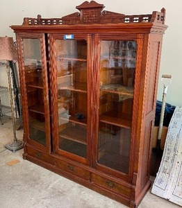 lot 171A image: Antique Cabinet With Glass Doors Measuring 60 Inches Wide 16 Inches Deep And 74 Inches Tall. Hand Carved. Three Glass Doors And Three Drawers With Adjustable Shelves