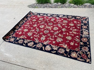 lot 176 image: Red And Blue Area Rug Measuring 90 x 66
