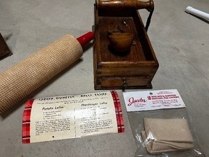 lot 259 image: Lefse Rolling Pin And Cloth Rolling Pin Covers, Instructions On How To Make Lefse, And A Small Wooden Storage Compartment