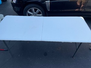 Life Time White Folding Table 6 Feet Long by 30 Inches Wide by 29 Inches Tall. Missing a Screw Holding the Frame to the Top on 12 of the Table.