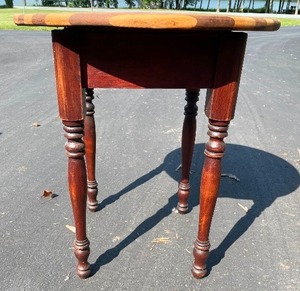 Round Wooden Table. 20 Inches Tall by 18 Inch Diameter. The Top Is Cracked Along a Glue Line.