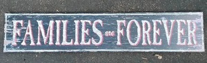 Families Are Forever Decorative Sign. 50 Inches Wide by 10 Inches Tall.