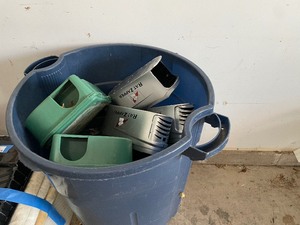 Large Garbage Can Filled with Rodent Traps and Rat Zappers.
