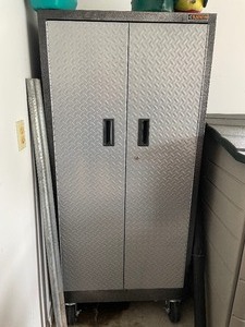 Gladiator Industrial Storage Cabinet. Has Heavy Duty Pivoting Casters. Includes Three Adjustable Shelves. Dimensions 65 12 Inches Tall by 30 Inches Wide by 18 Inches Deep.