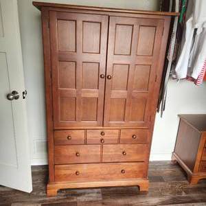 Stanley Furniture Armoire measuring 36 inches wide by 17 inches deep and 62 inches tall featuring two doors that open and three drawers