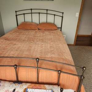 Metal queen bed frame with Sleep Number, measuring 62 inches wide by 84 inches long