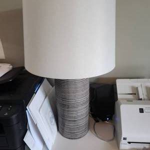 Table lamp measuring 25 inches tall and 13 inches in diameter
