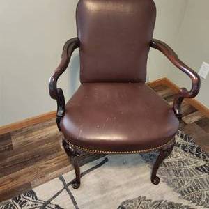 Desk chair, wood and leather, measuring 25 inches wide by 25 inches deep by 36 inches tall