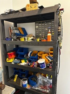 Plastic shelving unit and all tools and accessories on top