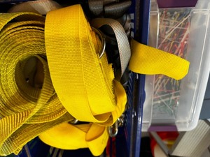 Crate of straps and tub of zip ties