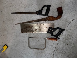 Bucket of hand saws