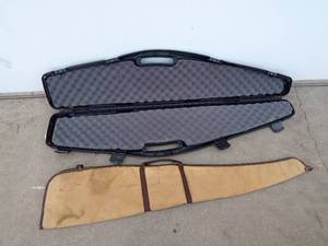 lot 104 image: 1 Hard and 1 canvas gun cases