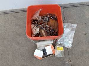 lot 101 image: Pail of screws, nails, and hardware