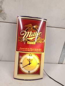 lot 89 image: Lighted Miller beer sign with clock