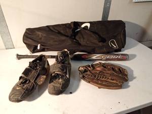 lot 67 image: Baseball bat and glove and Nike cleats in bag