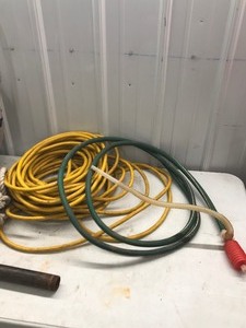 lot 422 image: Garden hose, PVC, electrical cords and metal pipe
