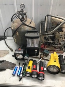 lot 429 image: Flash lights , saw guards, jack stand, 3 HP Tecumseh motor for ice auger and air tank with hose and gauge