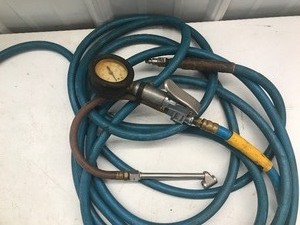 lot 589 image: 3 Hoses, flowmeter regulator including gas hose with fittings new in pkg, quick connect and air hose with tire gauge and accessories