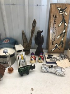 lot 648 image: Wooden Napa Valley wine boxes, carved wooden eagle, new shoes, weather radio, Rosette irons, Coca-Cola vintage juicer and more