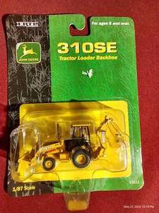 lot 124 image: Ertl Die-Cast 187 John Deere 310SE - NEW