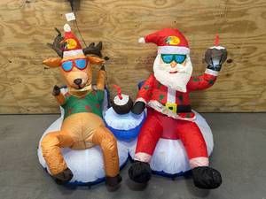 lot 107 image: BASS PRO SHOPS Santa and Reindeer Festive Float- 5 Feet Wide