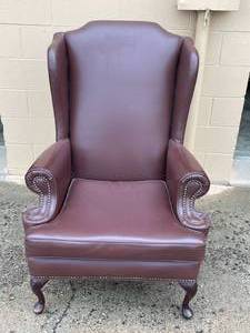 lot 71 image: Classic Brown Leather Wingback Chair