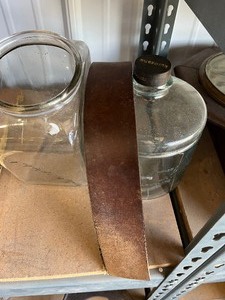 lot 41 image: Glass containers and barber leather