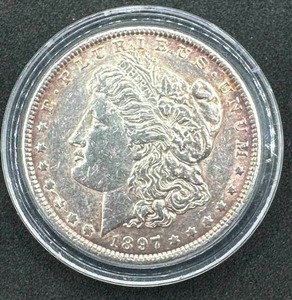 lot 38 image: 1897 Morgan Silver Dollar XFAU in AIrtite