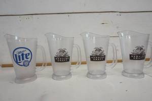 lot 740 image: Miller Genuine Draft & Miller Lite Plastic Pitcher set of 4