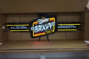 lot 28 image: Miller Genuine Draft Neon Beer Sign 59 x 17