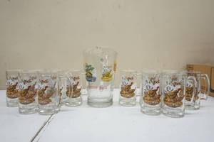 lot 109 image: Series 2 Schmidt Beer Pitcher and twelve mugs