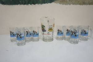lot 113 image: Series 2 Schmidt Beer Pitcher and twelve mugs