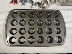 lot 72 image: Vintage Cookie Cutters and Muffin Tins