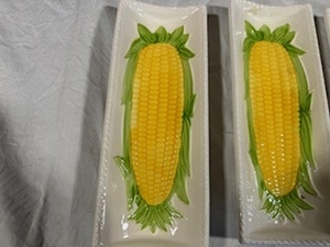 lot 85 image: Four Ceramic Corn on the Cob Holders and Williams Sonoma Dish