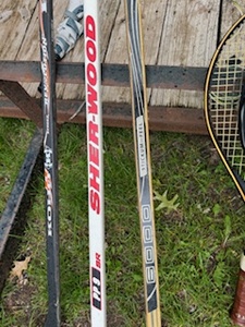 lot 11 image: Vintage Tennis Rackets and Hockey Sticks