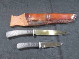 lot 15 image: (CNTR) Camp Knife Set, KangarooPiggy Back Sheath - Carbon Fiber Skales with Red Liners - Maker Donald Halter, Forged In Fire, Champion - Valued At $600 -  Knives 11 12 and 8 18 Overall Lengths