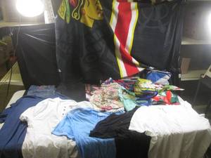 lot 112 image: (A-1) Assorted Clothes, Bags, Cooler and Blackhawks Throw