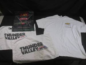 lot 156 image: (CSB) Chevrolet Performance T-Shirt Size XL, 2 Thunder Valley Hand Towels and Amalie Motor OilThe Xtermigator Bag