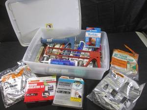 lot 291 image: (F-2) Tote with Lid Full of Assorted Caulking, Caulk Guns and Weather Stripping Etc
