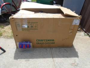 Craftsman 3 bin grass bagger system. Appears complete & new in the box As shown.