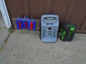 E-Go 56 volt battery & charger. Battery shows good. As shown.