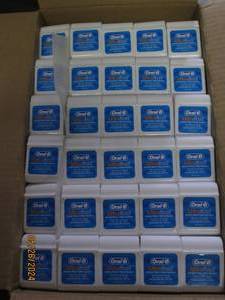 case of 144 oral B ultra floss...