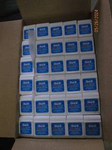 case of 144 oral B ultra floss...