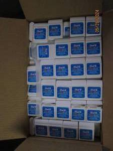 case of 144 oral B ultra floss...