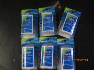box of 6 oral B ultra floss...
