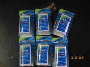 box of 6 oral B ultra floss...